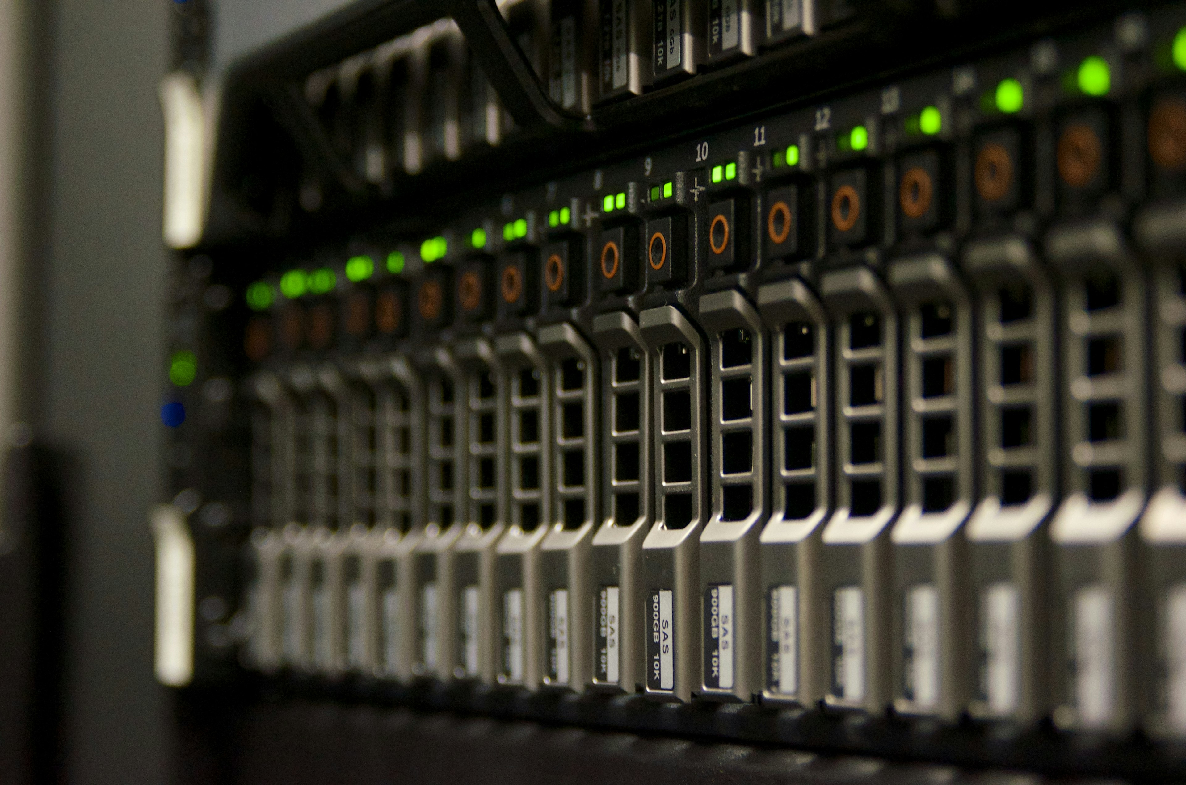 Rows of data-center server bays with green status lights
